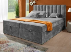 Boxspringbett mit individueller Kopfteilverstellung und Deko-Kissen