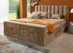 Boxspringbett mit individueller Kopfteilverstellung und Deko-Kissen